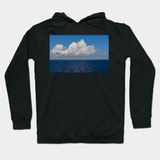 White cumulus clouds in sky over blue Baltic sea Hoodie